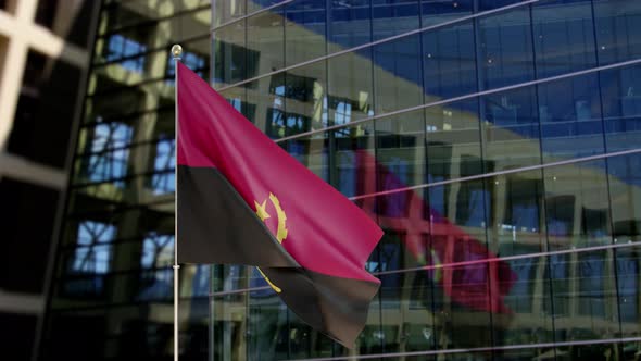 Angola Flag Waving On A Skyscraper Building