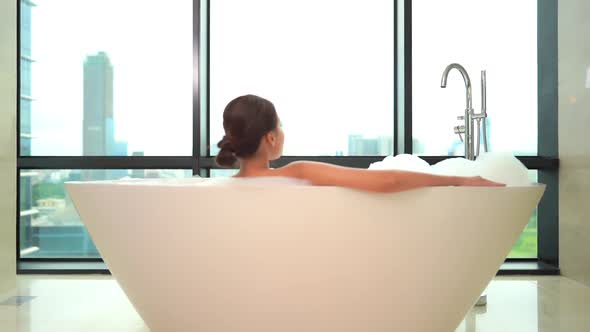 Young asian woman relax in bathtub