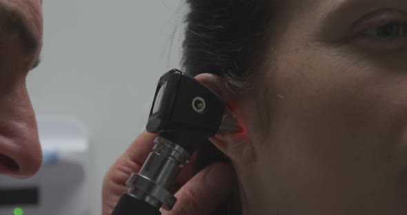 Medical professional examining patient alt