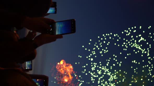 People are Shooting Xmas Fireworks Display with Their Phones