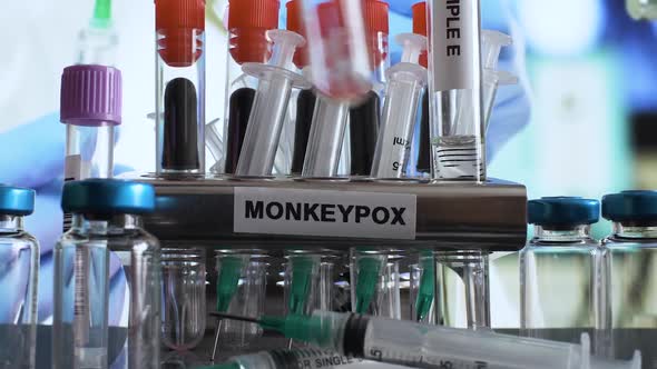 Monkeypox Test Tube Samples Being Placed In Rack. Close Up, Zoom Out