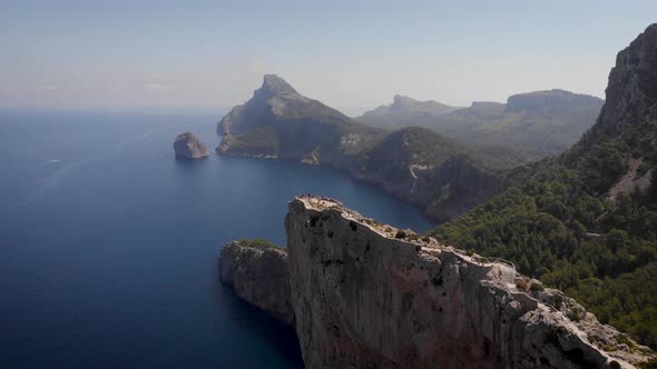 AERIAL: Cape Formentor viewing platform with tourists at north coast of Mallorca