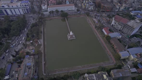 Aerial view over Kathmandu looking down at pond