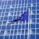 Footage EU Flag Fluttering on Strong Wind Against High Modern Business Center - VideoHive Item for Sale