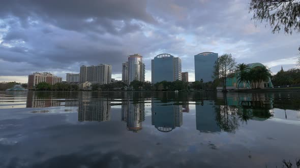 Pan left of buildings across the Lake Eola