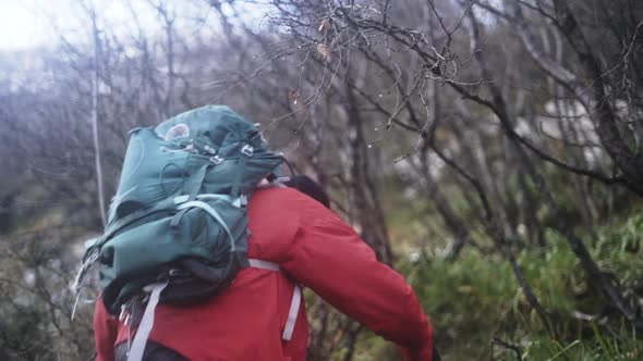 Hiker Walking Up Steep Hill