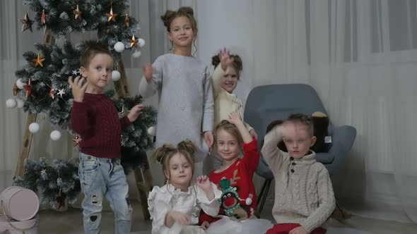 A group of children with New Year's gifts, happy friends for Christmas