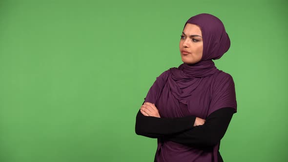 A Young Beautiful Muslim Woman is Angry  Green Screen Background