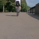 Man an Athlete, Gets on His Bike and Drives Away From the Camera in No Focus. - VideoHive Item for Sale