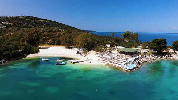 Aerial View of a White Sandy Beach with Many Sun Loungers Without People on a Sunny Day on the