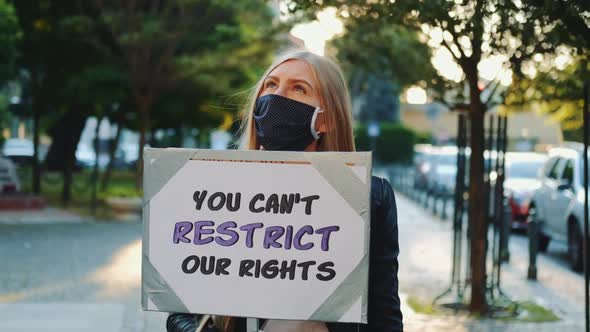 Blonde Woman Wearing Medical Mask Protesting Against Human Rights Restriction