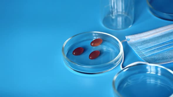 Doctor puts the tablets in a petri dish. Medical concept.