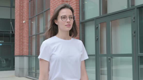 Close up of Young Woman Walking on Street, Front Pose