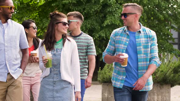 Friends Drinking Coffee and Shakes Walking in Park