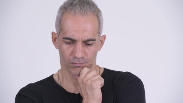 Serious Persian Man Thinking Against White Background