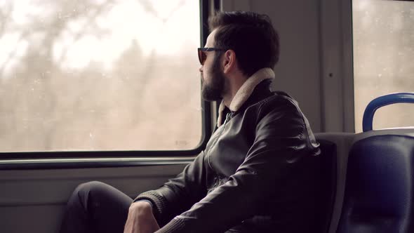 Man Looking On Train Window Worried On Problem. Man Under Stress Work After Fired Job On Tram.