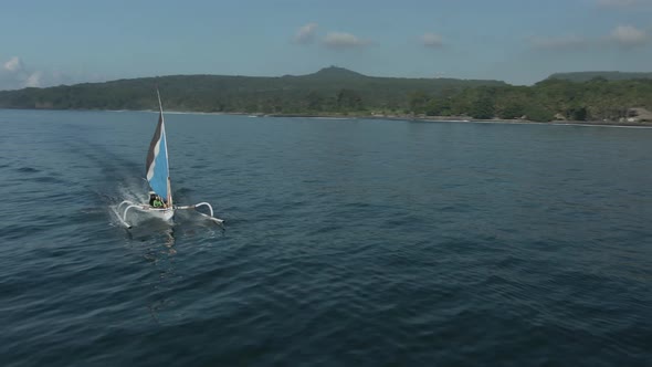 Aerial View Of Boat With Sail In Ocean In Bali, Indonesia