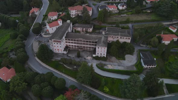 Caramulo old Sanatorium abandoned building in Portugal. Aerial top-down circling