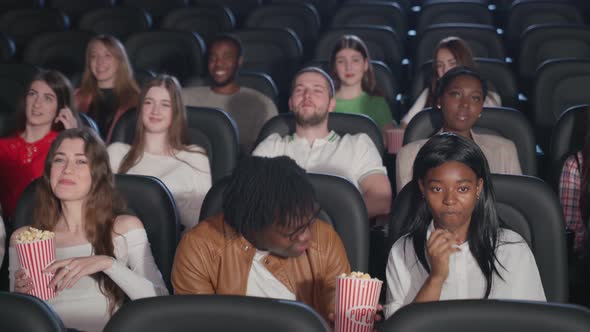 Multiracial Young Adults Watching Comedy Cinema