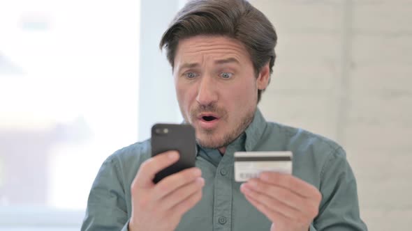 Middle Aged Man with Unsuccessful Online Shopping on Smartphone 