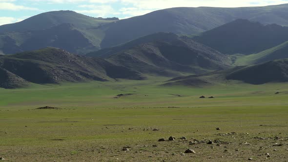 Green Flat Plain Next to Treeless Hills