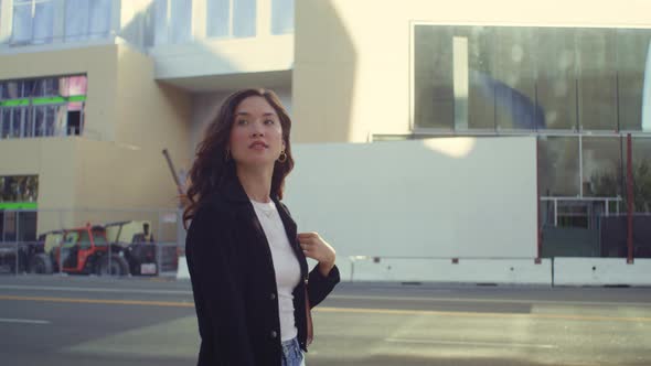 Stylish Woman Exploring Modern City Street