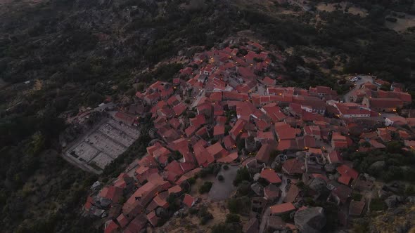 Portuguese historic Monsanto village at sunset in Portugal. Top-down aerial drone view