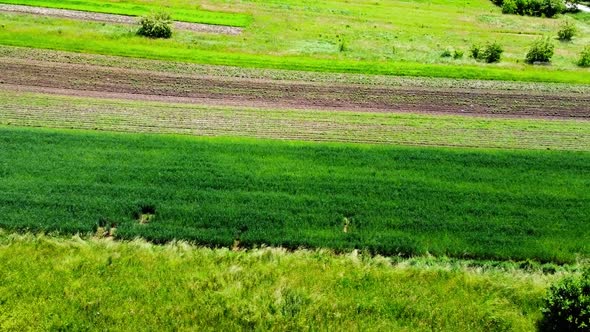 Aerial drone view of a flying over the rural agricultural landscape.