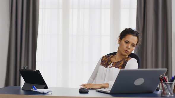 Thoughtful Woman Working From Home