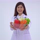 Doctor or nutritionist holding fresh fruit - VideoHive Item for Sale