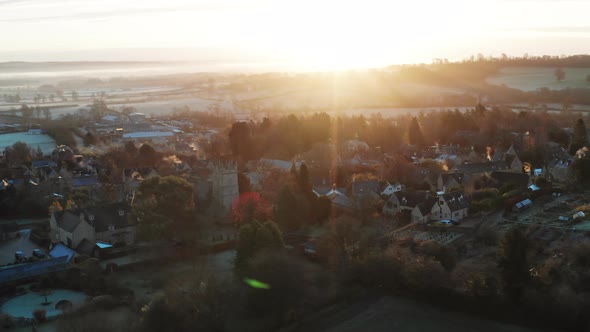 Aerial drone video of Typical English village and beautiful British countryside scenery in The Cotsw