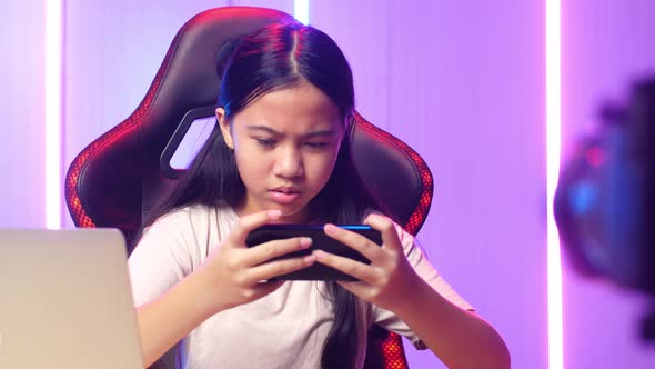 Asian Kid Girl Playing Video Game With Mobile Phone Then Lose The Game While Live Stream