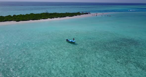 Tropical birds eye abstract shot of a summer white paradise sand beach and blue ocean background in 