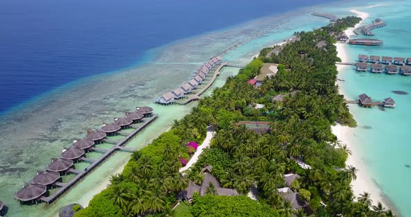 Luxury aerial travel shot of a white paradise beach and aqua turquoise water background 