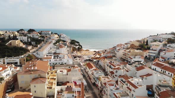 Picturesque houses of Carvoeiro resort town and beach, Algarve. Aerial view 