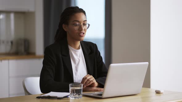 Afro American Girl Business Woman Sitting at Table at Office Using Laptop Taking By Video Call Slow