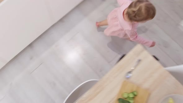 Little Cute 2 Years Old Girl Having Fun Running Around Kitchen Table Instead of Eating Problems How