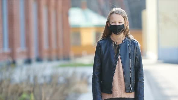 Girl Wearing a Mask Protect Against Coronavirus and Gripp