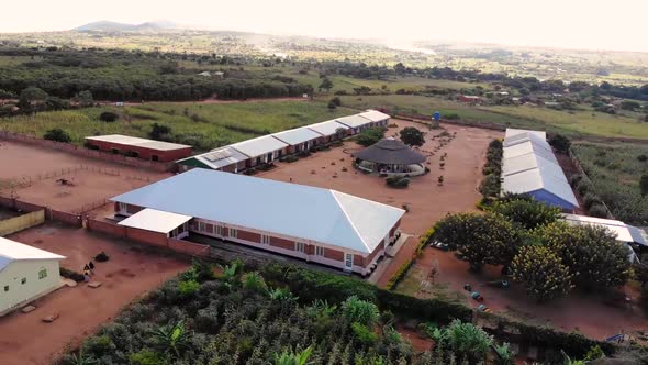 Refugees at the Camp in Malawi Going for a Walk in a Yard, Drone View