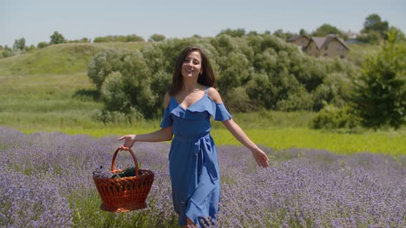 Charming Woman with Basket Walking in Floral Glade