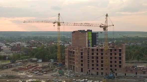 Aerial View of Construction Site with Building Cranes and High Rise Apartment Buildings in a City