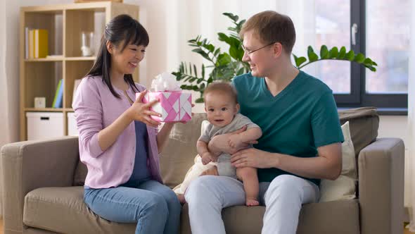Happy Family with Gift and Baby Boy at Home 19