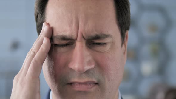 Middle Aged Man with Headache and Stress