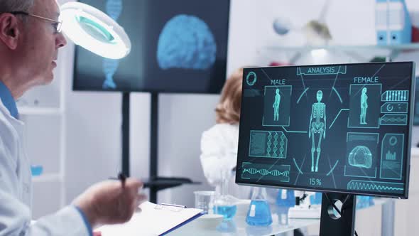 Close Up Shot of Adult Man Scientists Looking at Advanced Body Scan alt
