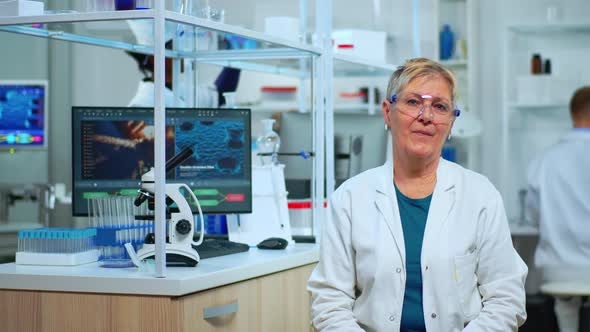 Portrait of Senior Scientist Woman Looking at Camera