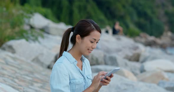 Woman use of smart phone at outdoor