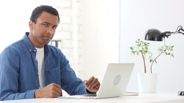 Afro-American Man Rejecting Deal, Shaking Head in Denial