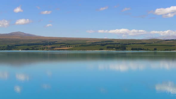 Lake landscape, clouds reflection on water at Lake Pukaki, New Zealand