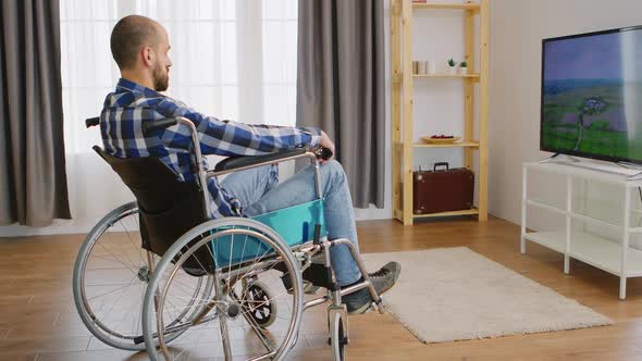 Paralysed Young Man Watching Tv