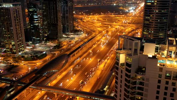 Aerial hyperlapse of a busy highway in Dubai at night, U.A.E.